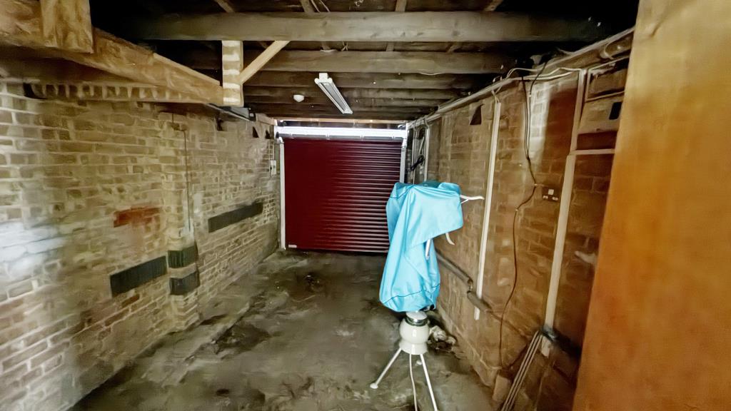 Lot: 83 - SEMI-DETACHED BUNGALOW IN NEED OF REFURBISHMENT - Internal image of garage from inside